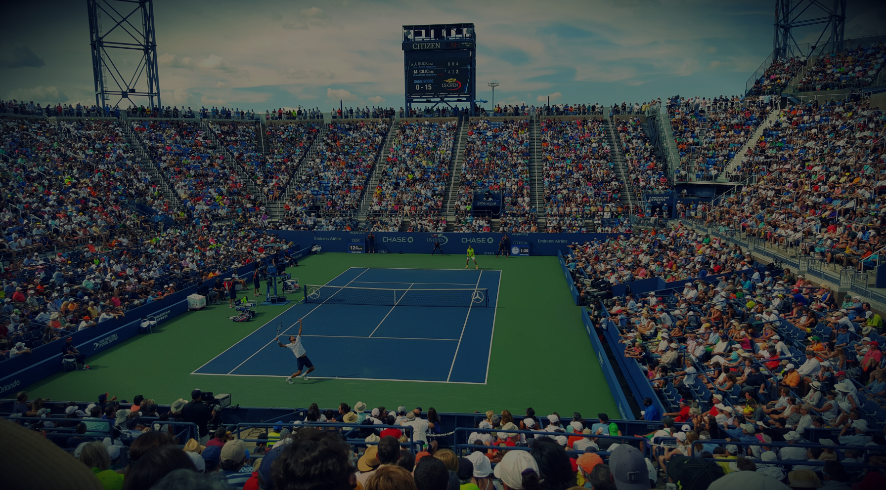 Tennis match in a crowded court